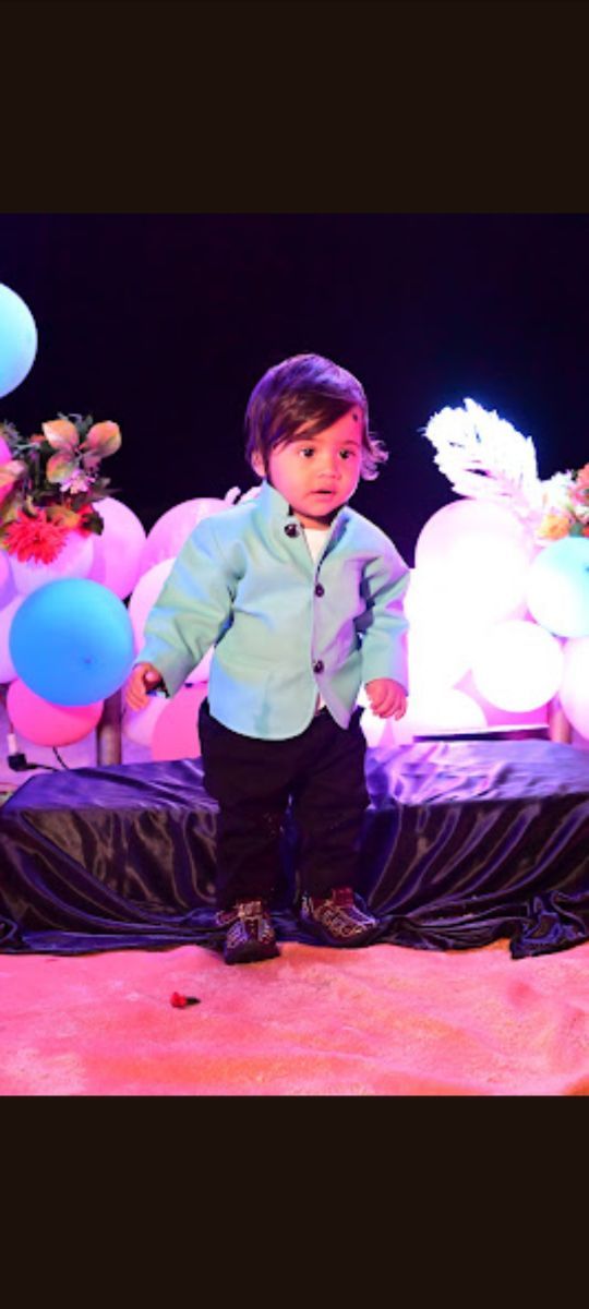 Customer child wearing a teal Lil Homies bandhgala suit at a celebration