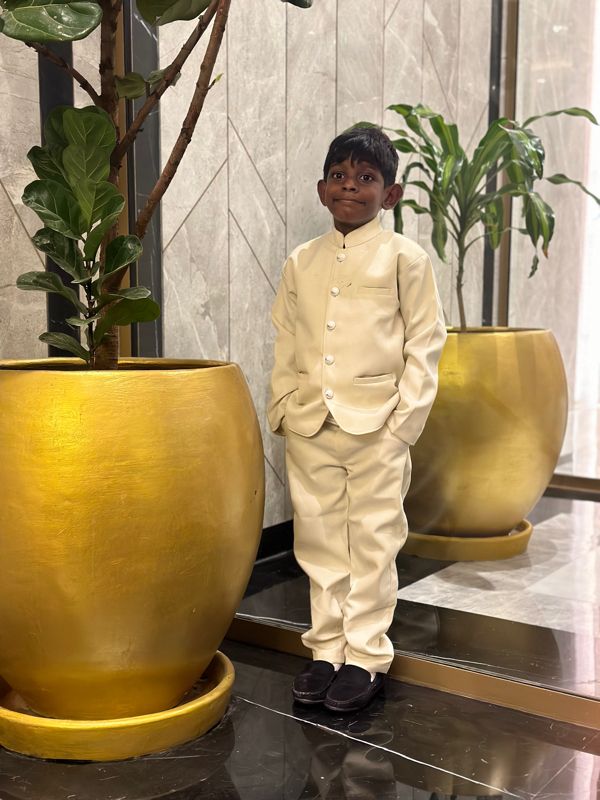 Customer child wearing a cream Lil Homies bandhgala suit